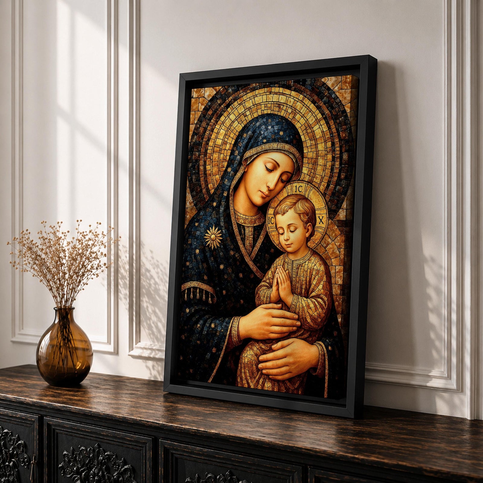 Byzantine style mosaic painting of the Virgin Mary holding the child Jesus, both with heads gently inclined and halos behind them, the child shown with hands clasped in prayer while Mary supports him, rendered with golden mosaic tiles and rich dark blue garments in a traditional Christian icon composition.
