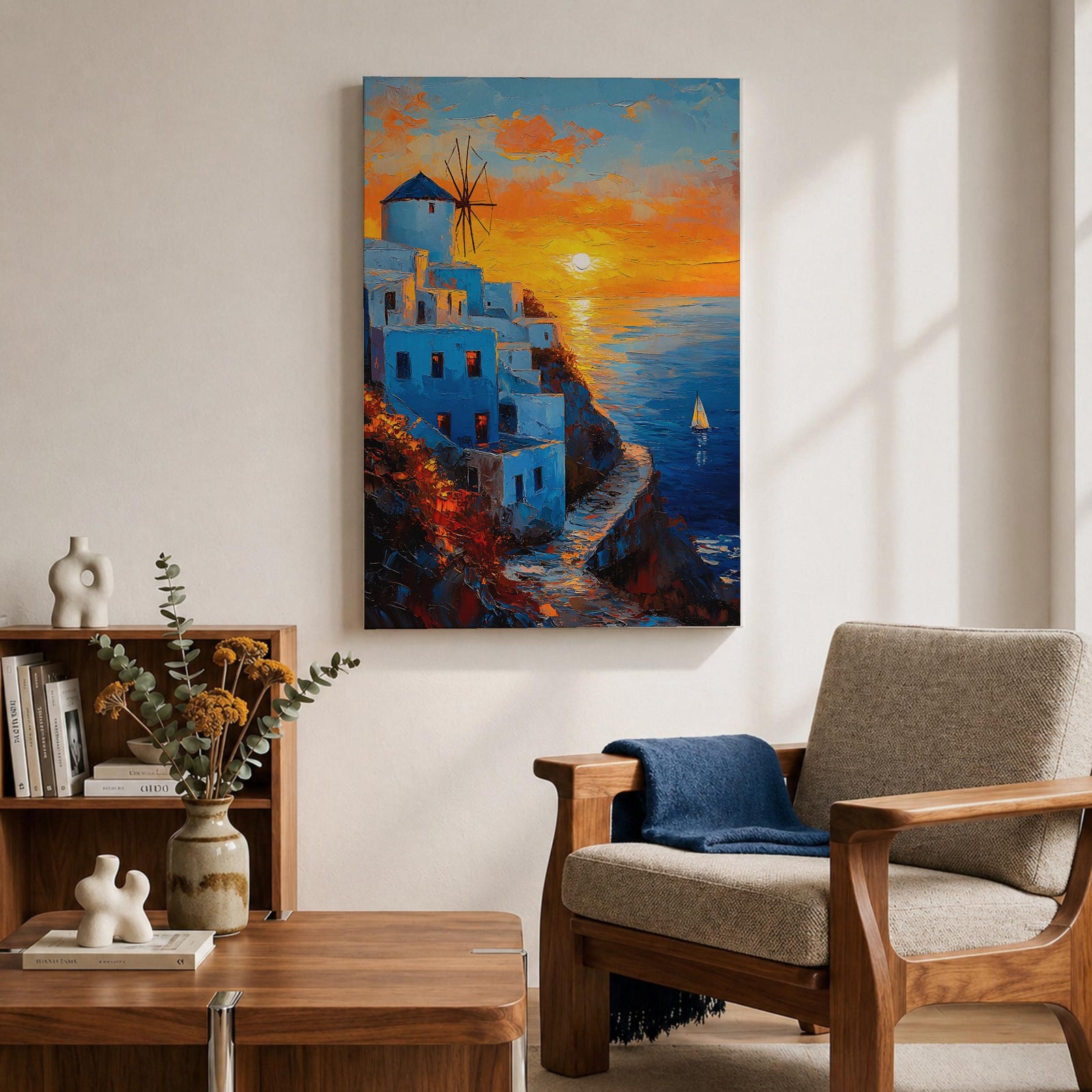 An impasto style framed canvas painting depicting a Santorini sunset over whitewashed buildings with a windmill on a cliffside overlooking the sea. The vibrant sunset sky reflects on the water with a small sailboat visible, capturing a Mediterranean coastal landscape scene with textured brushstrokes.