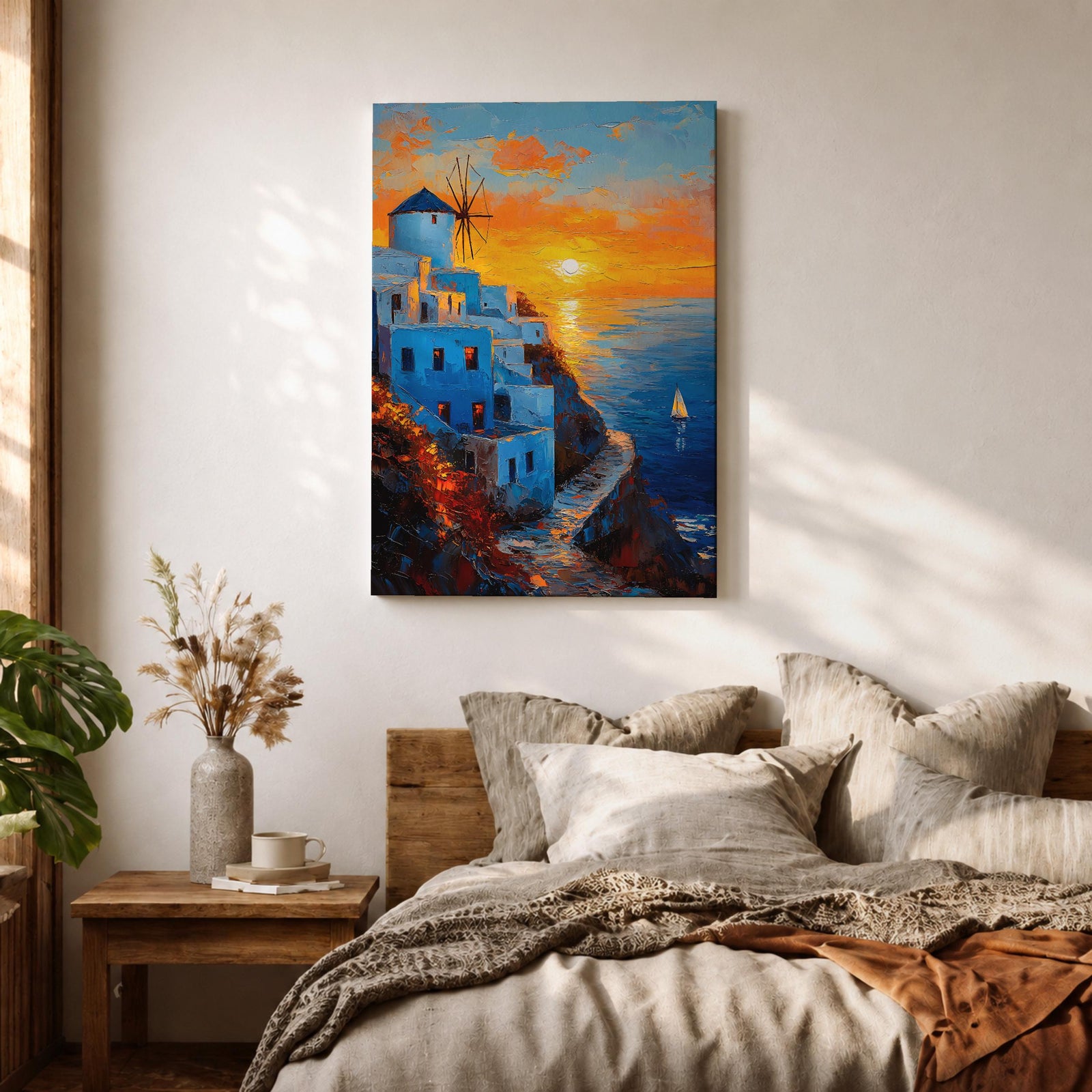 An impasto style framed canvas painting depicting a Santorini sunset over whitewashed buildings with a windmill on a cliffside overlooking the sea. The vibrant sunset sky reflects on the water with a small sailboat visible, capturing a Mediterranean coastal landscape scene with textured brushstrokes.