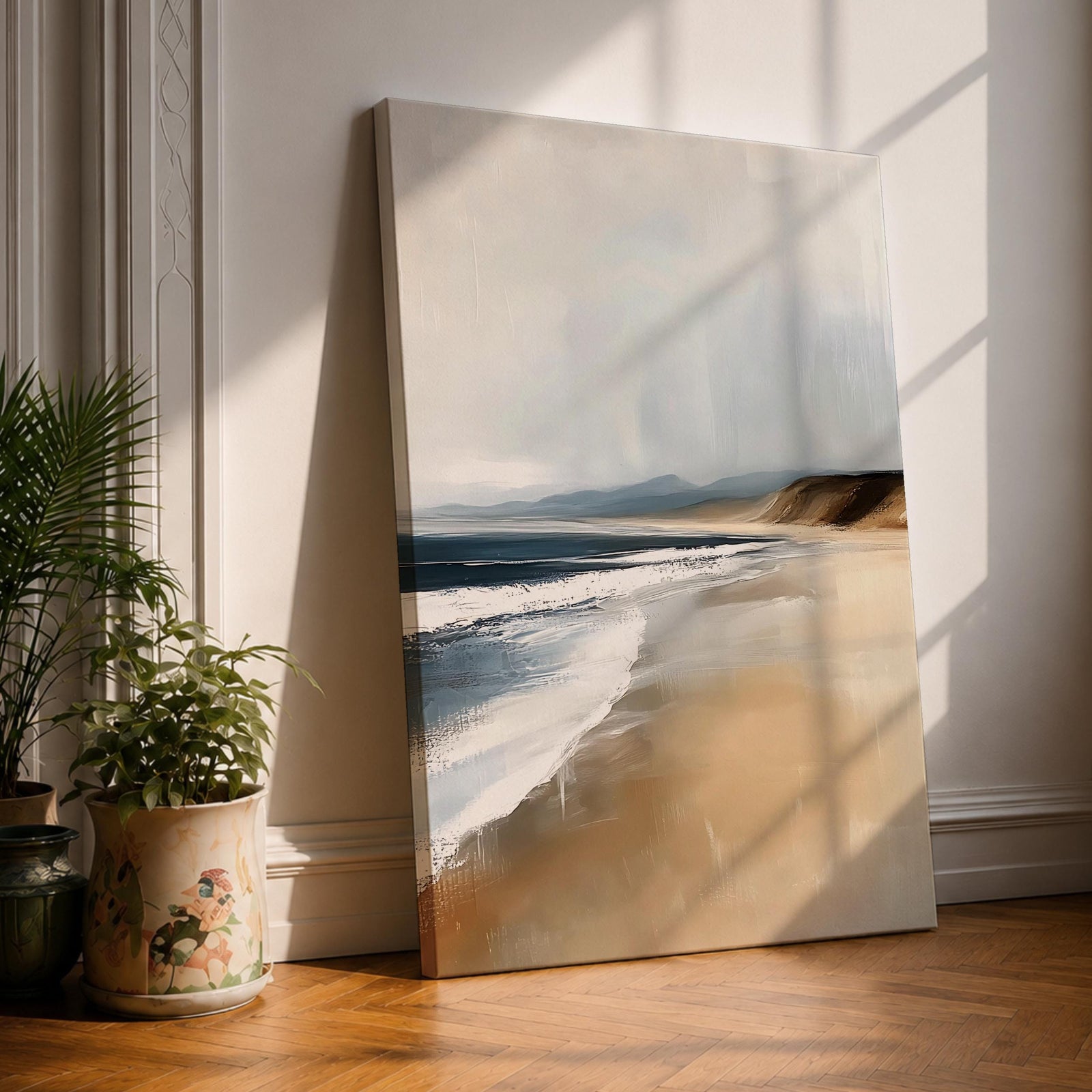 A vintage style framed canvas wall art depicting a serene coastal landscape with gentle waves meeting a sandy beach under a cloudy sky. The artwork captures the natural beauty of the shoreline with soft, muted tones and a nostalgic, timeless aesthetic.