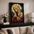 Stained glass style artwork of the Virgin Mary with head bowed and hands clasped in prayer, wearing a cream veil and red garment, surrounded by a radiant circular halo and red roses at the base, rendered with detailed stained glass panels and rich colors in a devotional Marian composition.
