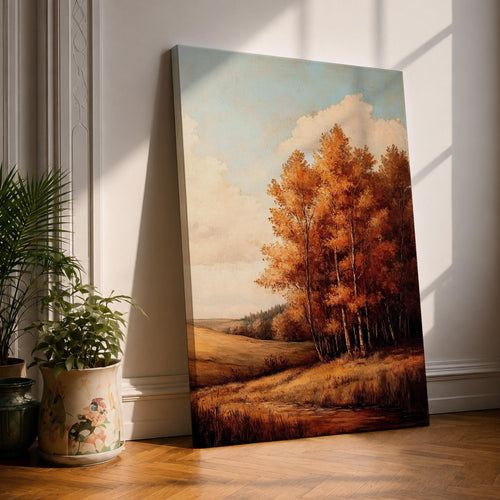 A framed vintage-style painting depicting an autumn landscape with a cluster of orange and yellow fall trees beside a gently rolling meadow under a partly cloudy sky. The artwork captures the serene beauty of a rustic countryside in fall with detailed foliage and soft natural tones.