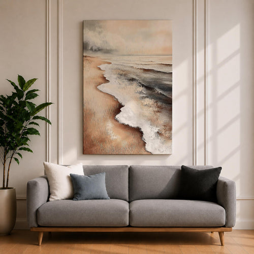 A framed canvas painting of a coastal seascape depicting waves gently washing onto a sandy beach under a cloudy sky. The artwork captures the natural landscape with realistic textures and muted tones, emphasizing the ocean shore and shoreline details in a classic style.