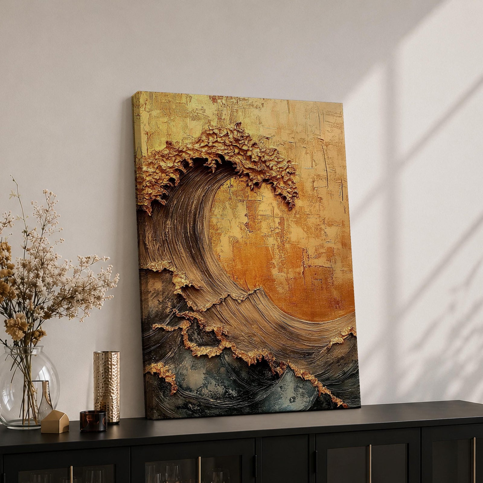 A textured framed canvas artwork depicting a large curling ocean wave with intricate raised details and a vintage style. The wave is rendered with thick brush strokes and layered textures in warm golden and earthy tones, creating a dynamic and tactile representation of coastal nature.