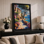 This artwork depicts a Mediterranean coastal scene featuring a charming seaside pathway lined with vibrant flowers and rustic buildings. The textured brushstrokes create a lively impressionistic landscape with a tree in the foreground and boats floating on the blue sea, capturing the essence of coastal tranquility.