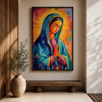 Colorful devotional painting of Our Lady of Guadalupe shown with hands clasped in prayer, wearing a blue star covered mantle over a rose dress while radiant golden rays form a glowing halo behind her figure. The composition presents the Virgin Mary in a vibrant painterly style with bold brushstrokes and centered sacred portrait.