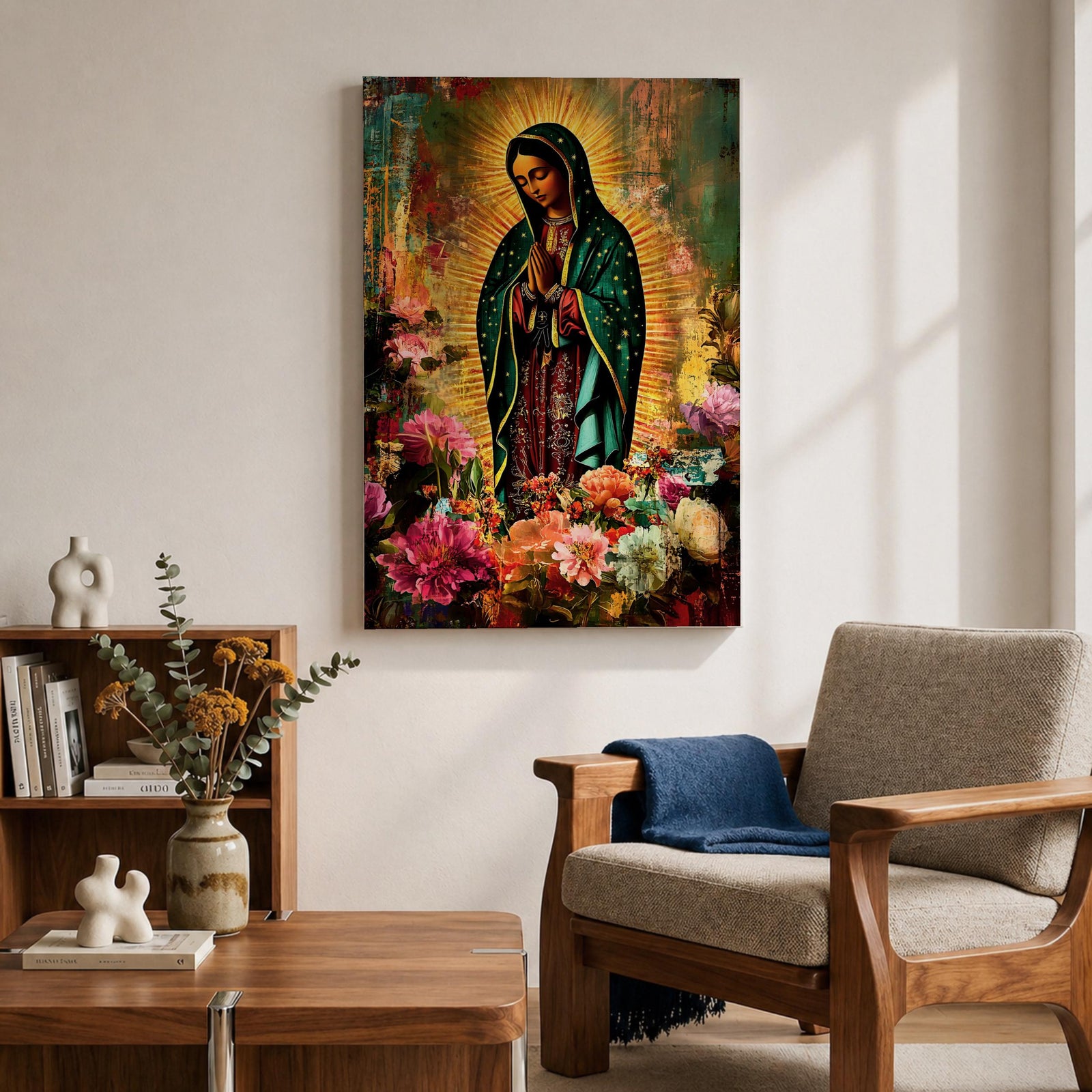Devotional painting of Our Lady of Guadalupe standing with hands clasped in prayer, wearing a dark green star patterned mantle over a red dress and surrounded by radiant golden rays. The composition features colorful blooming flowers in the foreground framing the Virgin Mary in a vibrant painterly religious portrait.