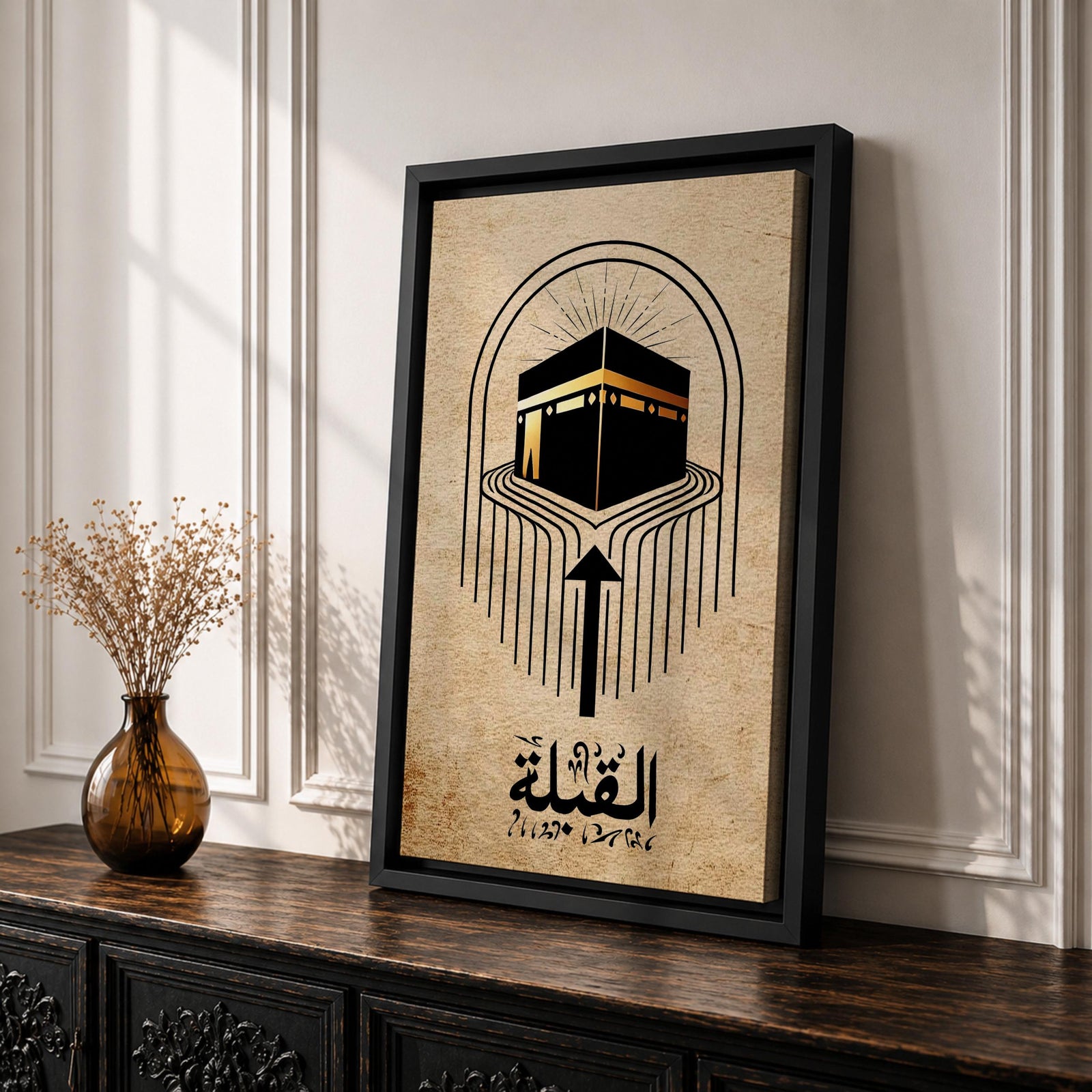 Minimalist Islamic artwork showing the Kaaba with flowing directional lines pointing toward it to symbolize the Qibla prayer direction, featuring Arabic calligraphy reading “Al-Qibla” beneath the geometric design, rendered in black and gold tones on a warm sepia parchment-style background.