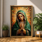 Mosaic style portrait of Our Lady of Guadalupe with hands clasped in prayer, wearing a green mantle and pearl adorned garments while radiant golden rays form a halo behind her head. The composition uses detailed mosaic tile textures to create the Virgin Mary’s serene expression in a traditional Catholic devotional portrait.