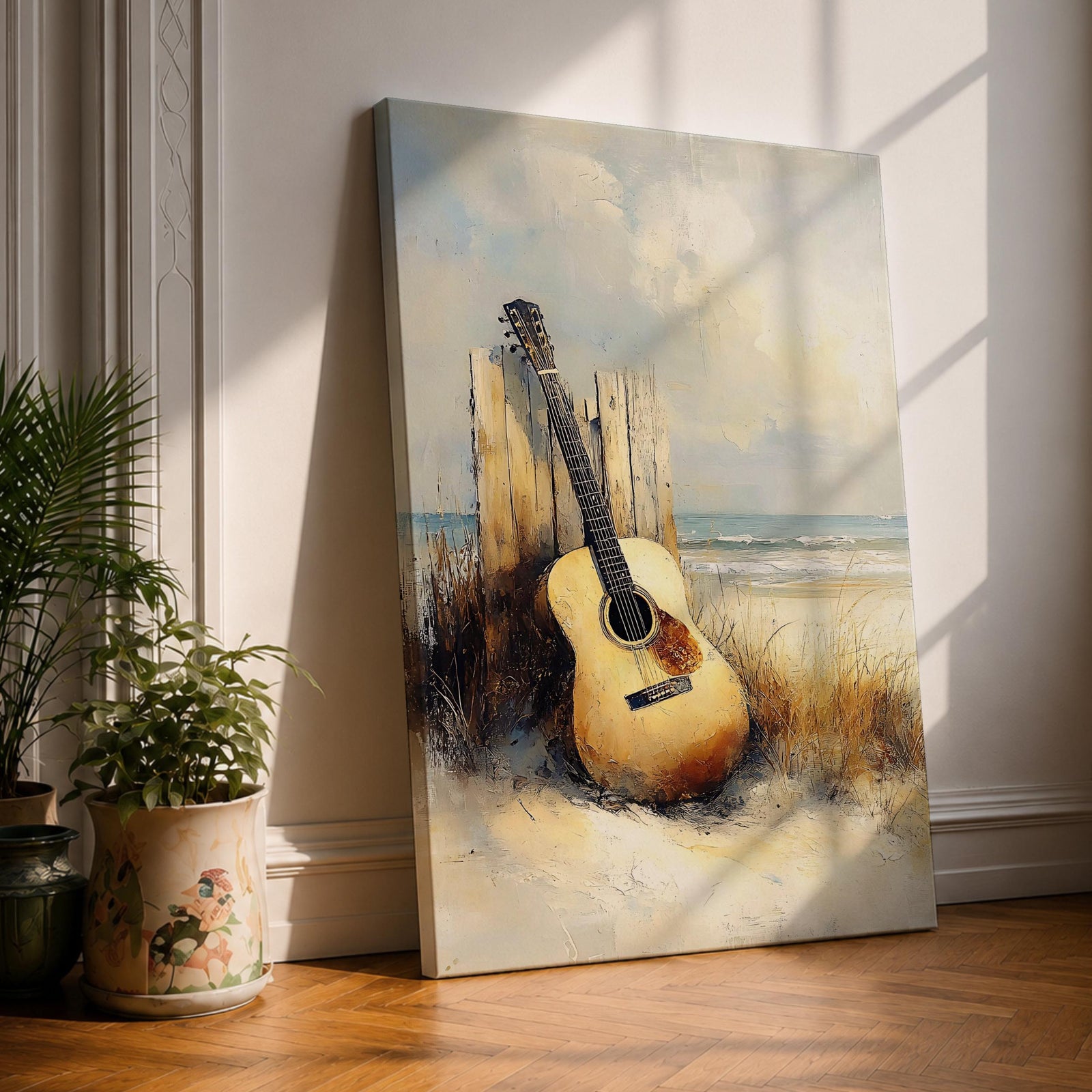 A vintage-style framed canvas painting of an acoustic guitar resting against weathered wooden posts on a sandy beach with coastal grasses and ocean waves in the background, rendered with textured brushstrokes and warm tones capturing a nostalgic coastal music theme.