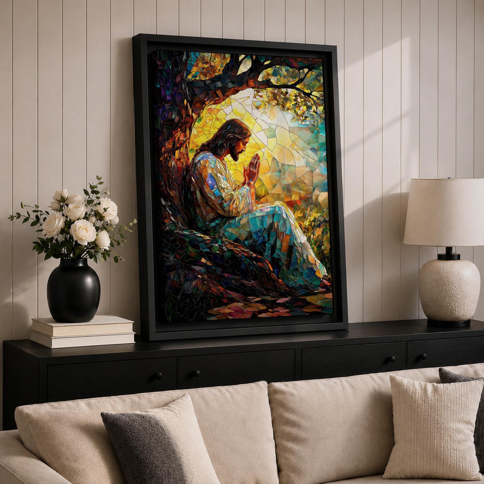 Mosaic style artwork of Jesus Christ seated beneath a large tree with hands joined in prayer, rendered in a stained glass inspired composition with colorful tessellated pieces forming his robe, the tree branches, and a glowing sunrise behind him, creating a devotional Christian scene with strong light and intricate mosaic detailing.