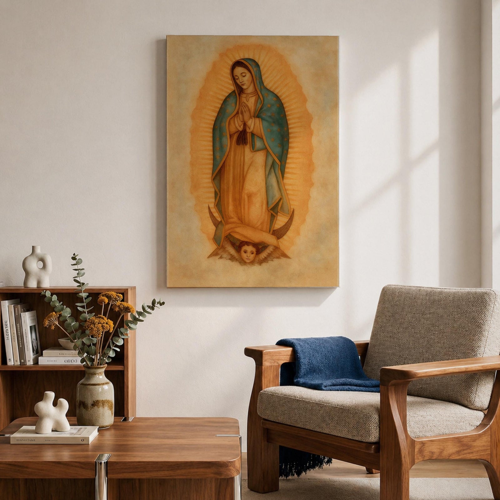 A framed vintage-style depiction of Our Lady of Guadalupe shows a praying woman draped in a starry mantle with a glowing aura, standing on a crescent moon supported by an angel's face, rendered in warm tones with a textured aged background.