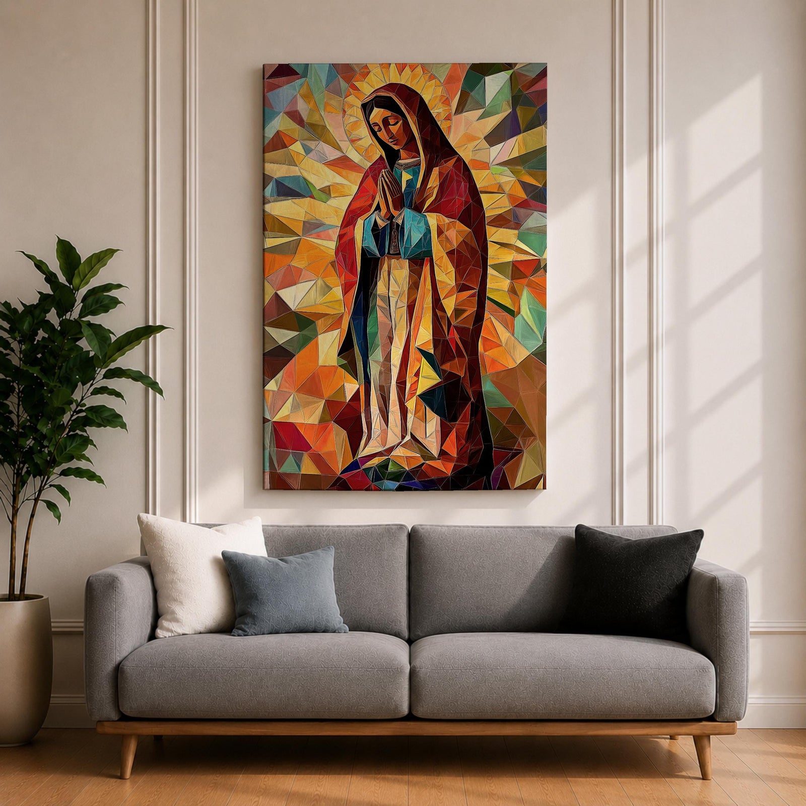 Geometric mosaic style depiction of Our Lady of Guadalupe shown standing in prayer with hands joined, surrounded by radiant golden halo rays and colorful angular shapes forming a stained glass inspired composition that highlights the Virgin Mary in a modern geometric Catholic devotional design.