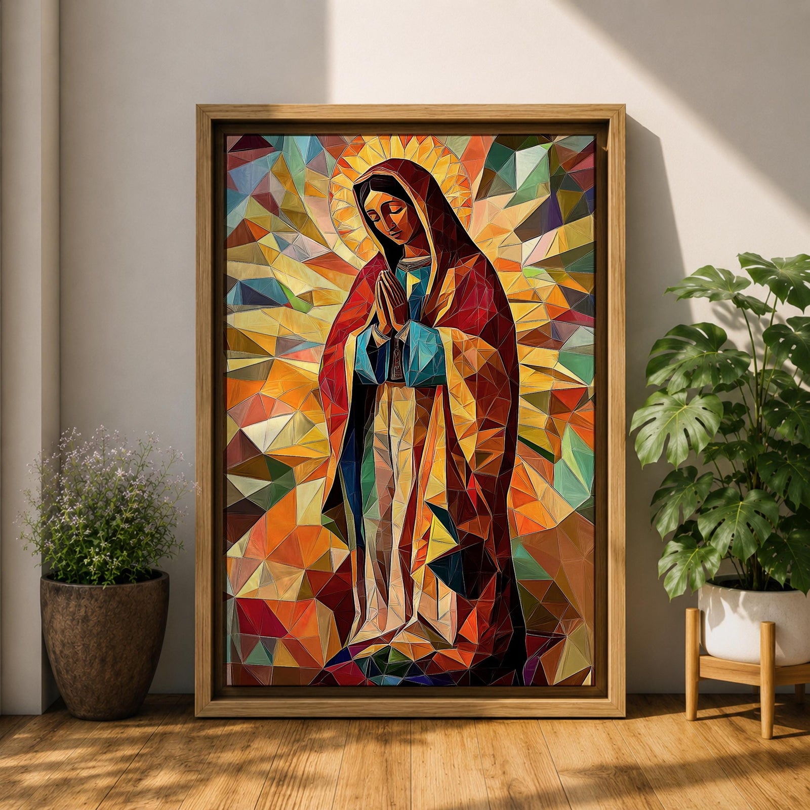 Geometric mosaic style depiction of Our Lady of Guadalupe shown standing in prayer with hands joined, surrounded by radiant golden halo rays and colorful angular shapes forming a stained glass inspired composition that highlights the Virgin Mary in a modern geometric Catholic devotional design.