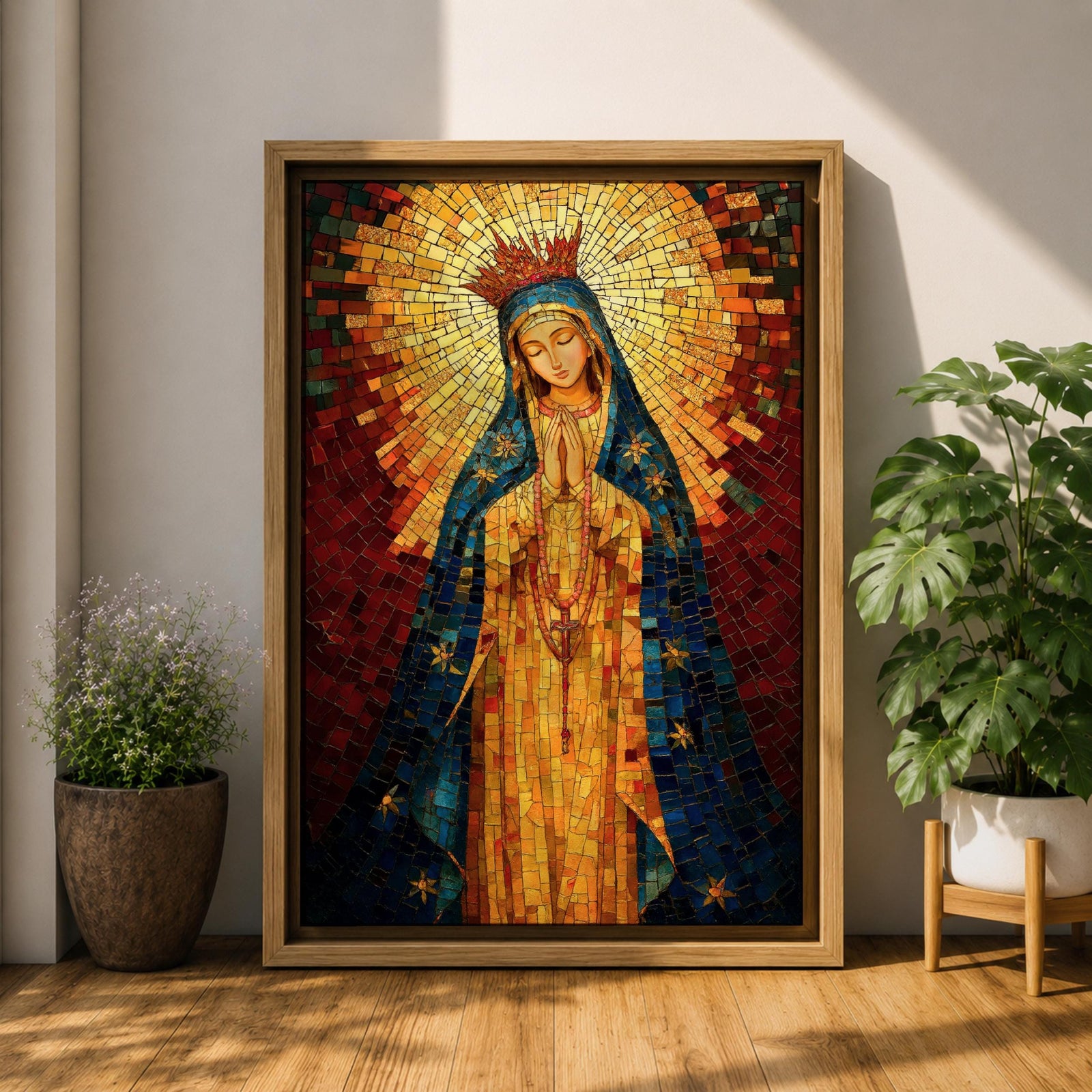 A mosaic-style icon of Virgin Mary depicts the Blessed Mother with hands clasped in prayer, wearing a blue mantle adorned with stars and a radiant golden halo behind her head, composed of small colorful tiles forming a vibrant religious portrait.
