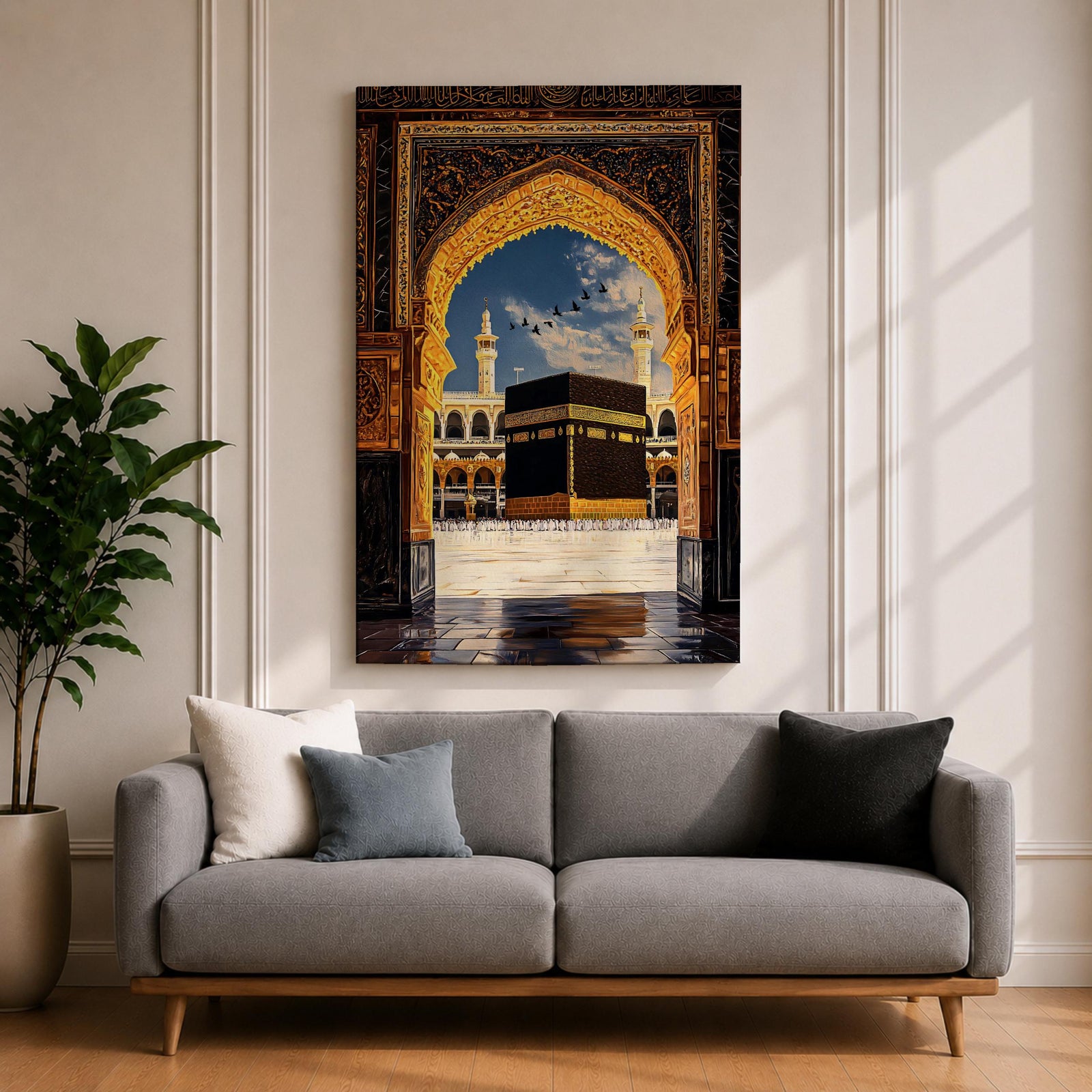 Artwork depicting the Kaaba in Masjid Al Haram in Mecca viewed through an ornate golden mosque arch, with two tall minarets rising behind the sacred courtyard and birds flying across a bright blue sky.
