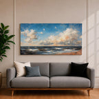 A panoramic seascape painting showing rolling ocean waves moving toward a sandy shoreline beneath a wide sky filled with soft clouds and warm light. The composition stretches across the horizon with textured brushstrokes capturing movement in the water and subtle reflections of blue, white and golden tones across the sea.