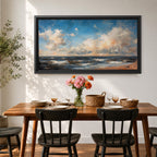 A panoramic seascape painting showing rolling ocean waves moving toward a sandy shoreline beneath a wide sky filled with soft clouds and warm light. The composition stretches across the horizon with textured brushstrokes capturing movement in the water and subtle reflections of blue, white and golden tones across the sea.