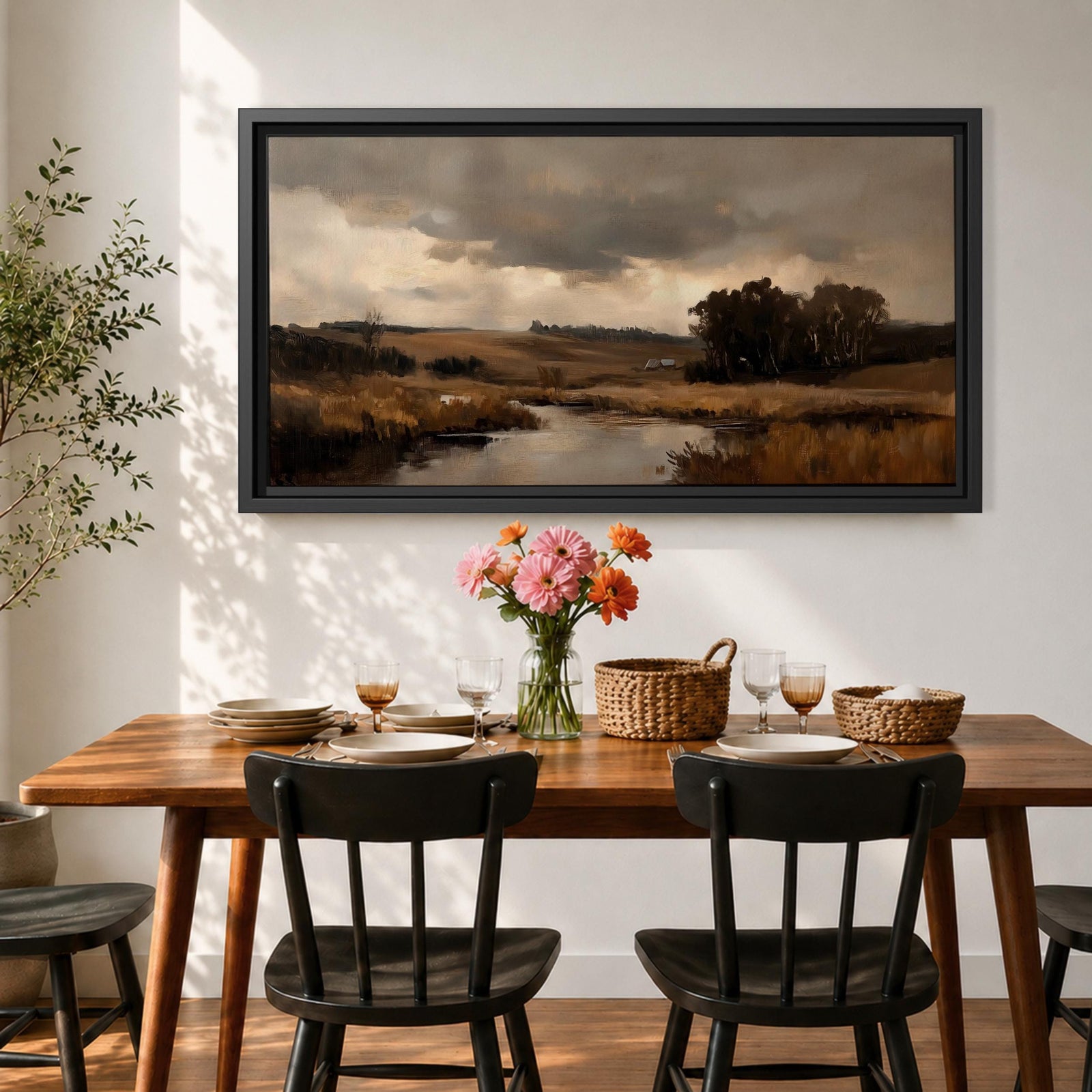 A panoramic countryside river landscape painting featuring a calm winding stream flowing through open rural fields with tall golden grasses and a distant farmhouse near a cluster of dark trees beneath a dramatic cloudy sky. The scene uses earthy browns and muted greens with soft painterly brushstrokes capturing a quiet pastoral prairie setting.