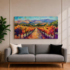 A panoramic vineyard landscape painting showing long rows of grapevines covered in red and golden autumn leaves stretching toward distant mountains beneath a bright sky. Purple grape clusters hang beside the vines while a central path leads through the field, capturing a colorful wine country valley with bold impressionist brushstrokes.