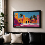 Panoramic painting of a Moroccan kasbah with tall palm trees and arched fortress gates rendered in bold palette knife brushstrokes. Bright orange, pink, and terracotta buildings contrast against a vivid blue sky, capturing the architecture of a Marrakech medina with textured walls and sunlit desert tones.