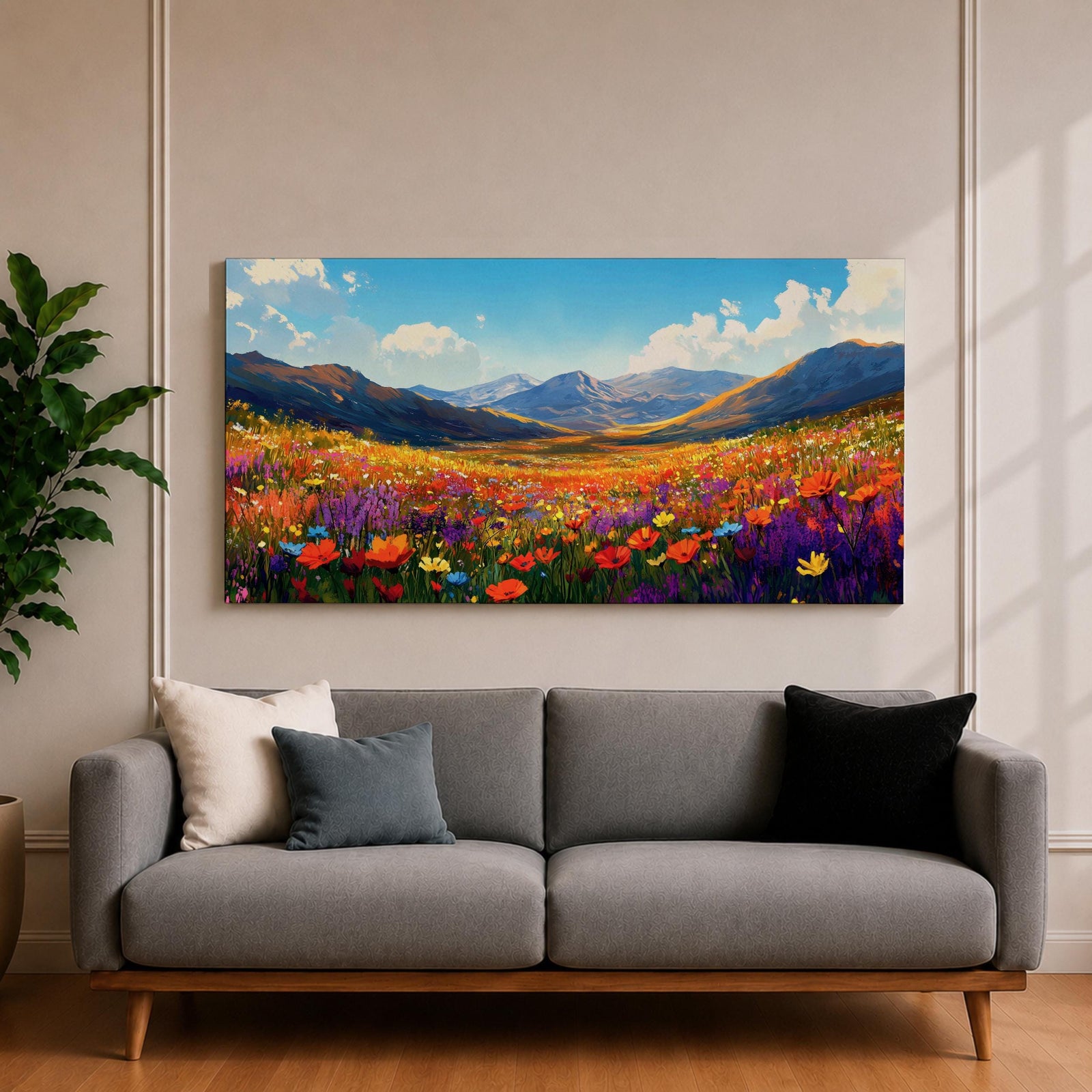 Panoramic painting of a vibrant mountain meadow filled with colorful wildflowers stretching toward distant alpine peaks. Red, yellow, purple, and blue blossoms cover the valley floor beneath a bright sky with soft clouds, while layered mountains rise along the horizon in a luminous natural landscape.