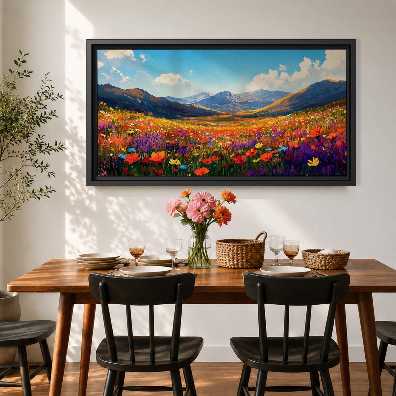 Panoramic painting of a vibrant mountain meadow filled with colorful wildflowers stretching toward distant alpine peaks. Red, yellow, purple, and blue blossoms cover the valley floor beneath a bright sky with soft clouds, while layered mountains rise along the horizon in a luminous natural landscape.