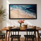 Panoramic painting of ocean waves rolling onto a sandy beach viewed from above. Thick textured brushstrokes form layered blue and turquoise surf breaking across the shoreline while white foam curls along the edge of the sand, creating a dynamic coastal seascape composition.