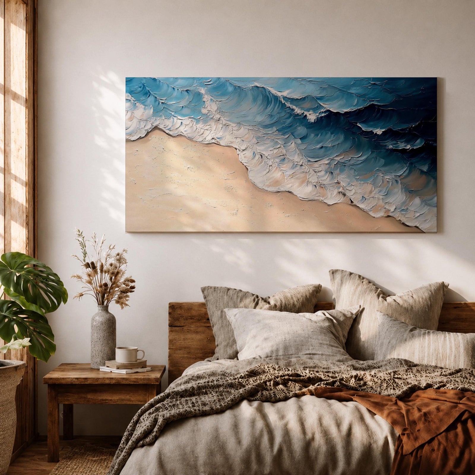 Panoramic painting of ocean waves rolling onto a sandy beach viewed from above. Thick textured brushstrokes form layered blue and turquoise surf breaking across the shoreline while white foam curls along the edge of the sand, creating a dynamic coastal seascape composition.