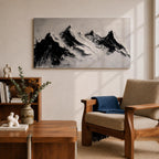 Panoramic black and white painting of alpine peaks with dramatic snowy mountains rising through mist and clouds. Thick textured brushstrokes create strong contrast between dark rocky ridges and bright snowfields, forming a minimalist monochrome mountain landscape stretching across a wide composition.