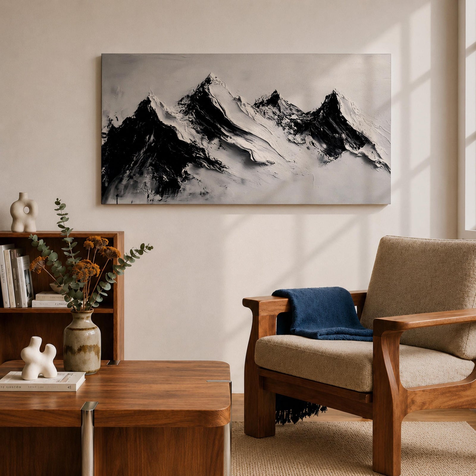 Panoramic black and white painting of alpine peaks with dramatic snowy mountains rising through mist and clouds. Thick textured brushstrokes create strong contrast between dark rocky ridges and bright snowfields, forming a minimalist monochrome mountain landscape stretching across a wide composition.