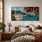 Panoramic painting of the Amalfi Coast with white seaside buildings and a domed church overlooking bright turquoise Mediterranean waters. Lemon branches heavy with citrus fruit frame the scene while mountains rise behind the coastal village beneath a blue sky with scattered clouds.