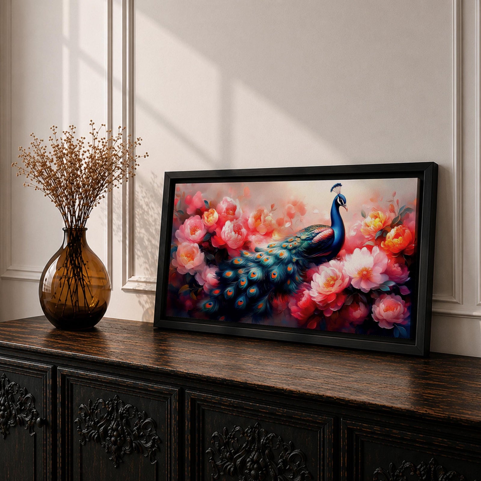Panoramic painting of a vibrant peafowl with a flowing blue and teal tail surrounded by large blooming peony flowers. Rich pink, coral, and red petals fill the composition while detailed feather eyes shimmer across the long tail, creating a colorful botanical scene with dramatic contrast and soft glowing light.