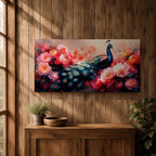 Panoramic painting of a vibrant peafowl with a flowing blue and teal tail surrounded by large blooming peony flowers. Rich pink, coral, and red petals fill the composition while detailed feather eyes shimmer across the long tail, creating a colorful botanical scene with dramatic contrast and soft glowing light.