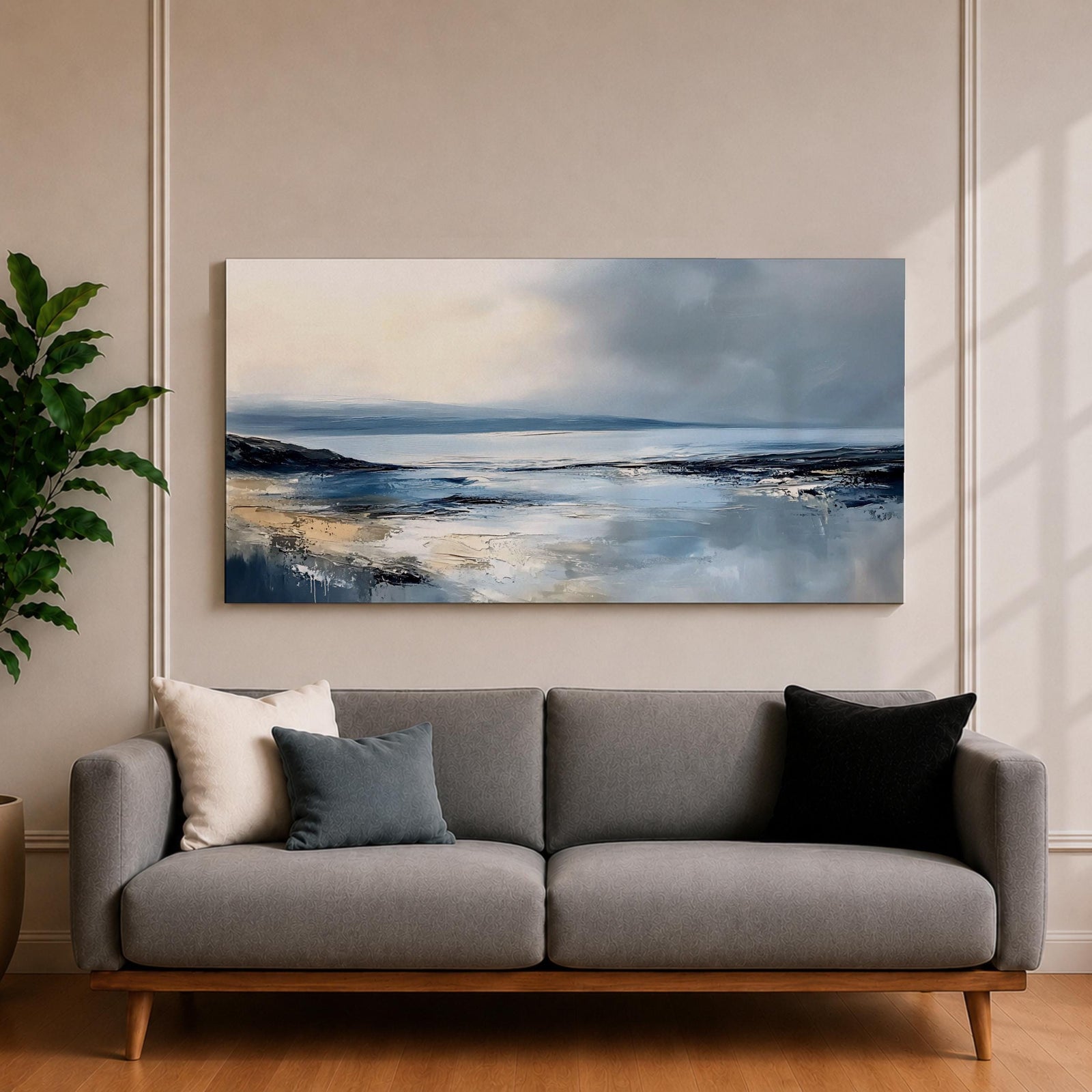 Panoramic abstract coastal seascape painting featuring a calm ocean shoreline with soft blue, gray, and sandy tones reflecting across the water beneath a cloudy horizon.