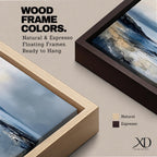 Panoramic abstract coastal seascape painting featuring a calm ocean shoreline with soft blue, gray, and sandy tones reflecting across the water beneath a cloudy horizon.