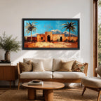 Panoramic painting of a Moroccan kasbah surrounded by palm trees in a desert oasis with the Atlas Mountains rising in the distance. The warm earthen architecture contrasts with a bright blue sky and textured brushstrokes capturing North African landscape scenery.