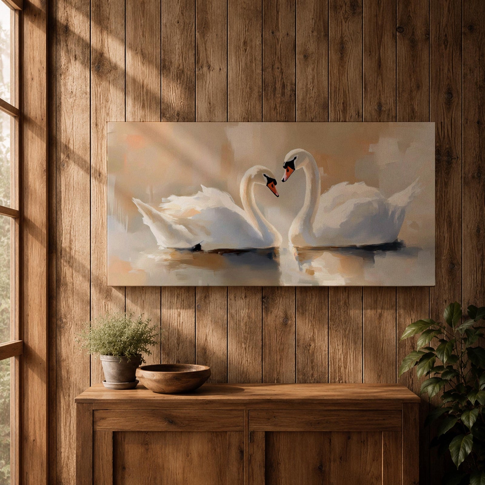 Panoramic painting depicting two white swans facing each other on calm water with their curved necks forming a heart shape. Soft brushstrokes and warm neutral tones surround the birds while gentle reflections appear on the lake surface, creating a serene composition centered on the pair of swans.