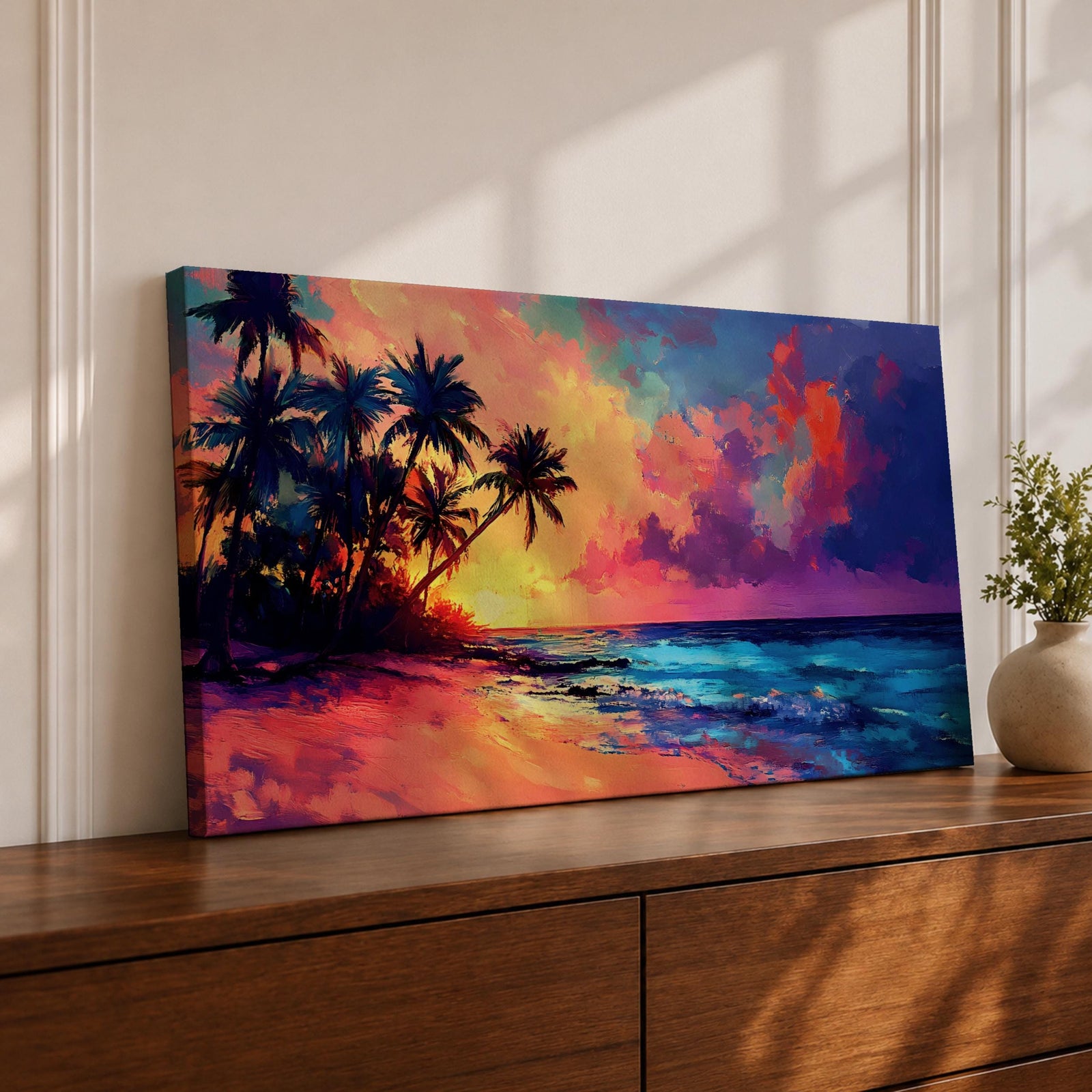 Panoramic tropical beach painting featuring tall palm trees leaning over a sandy shoreline as waves meet the coast beneath a vivid sunset. The sky glows with bold colors of orange, pink, purple, and blue reflecting across the ocean water, creating a dramatic island sunset scene with expressive brushstrokes.