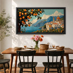 Panoramic coastal artwork showing a Mediterranean village overlooking the sea with white buildings and a domed church set against blue mountains. In the foreground a large lemon tree heavy with bright citrus fruit frames the scene while additional lemons and greenery fill the lower landscape, creating a vibrant Amalfi Coast inspired composition.