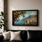 Panoramic coastal artwork showing a Mediterranean village overlooking the sea with white buildings and a domed church set against blue mountains. In the foreground a large lemon tree heavy with bright citrus fruit frames the scene while additional lemons and greenery fill the lower landscape, creating a vibrant Amalfi Coast inspired composition.