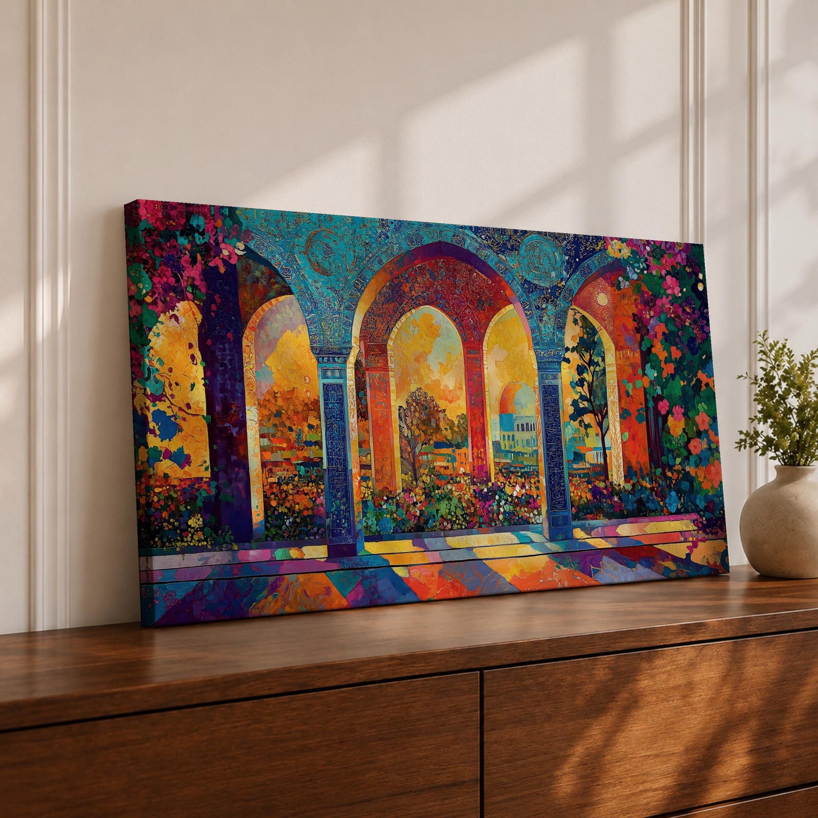 Panoramic artwork depicting ornate Moorish arches opening into a vibrant garden courtyard filled with colorful flowers and trees. Decorative tiled columns frame the arches while warm sunlight streams through, casting multicolored reflections across the floor and highlighting the detailed Islamic architectural patterns.