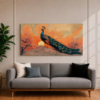 Panoramic artwork depicting a peacock standing on a rocky hill with its long iridescent tail feathers flowing behind it. The bird faces a glowing sunset with warm orange clouds and soft light illuminating the detailed blue and green plumage while flowering trees frame the scene.