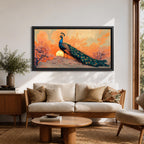 Panoramic artwork depicting a peacock standing on a rocky hill with its long iridescent tail feathers flowing behind it. The bird faces a glowing sunset with warm orange clouds and soft light illuminating the detailed blue and green plumage while flowering trees frame the scene.