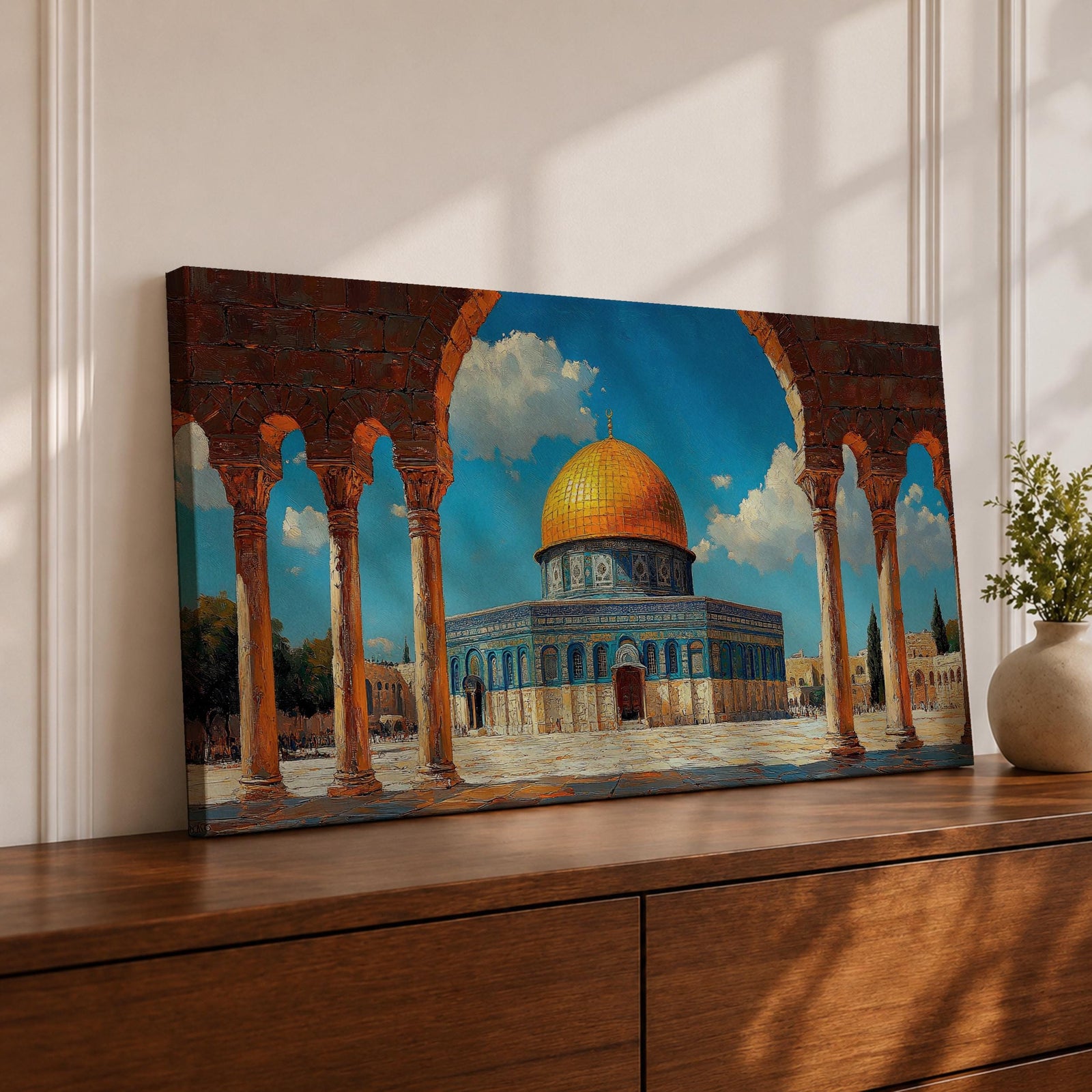 Panoramic artwork depicting the Dome of the Rock with its golden dome rising above blue tiled walls and stone courtyard. The mosque is framed by tall historic arches and columns in the foreground while bright blue sky and soft clouds highlight the iconic Jerusalem Islamic landmark.