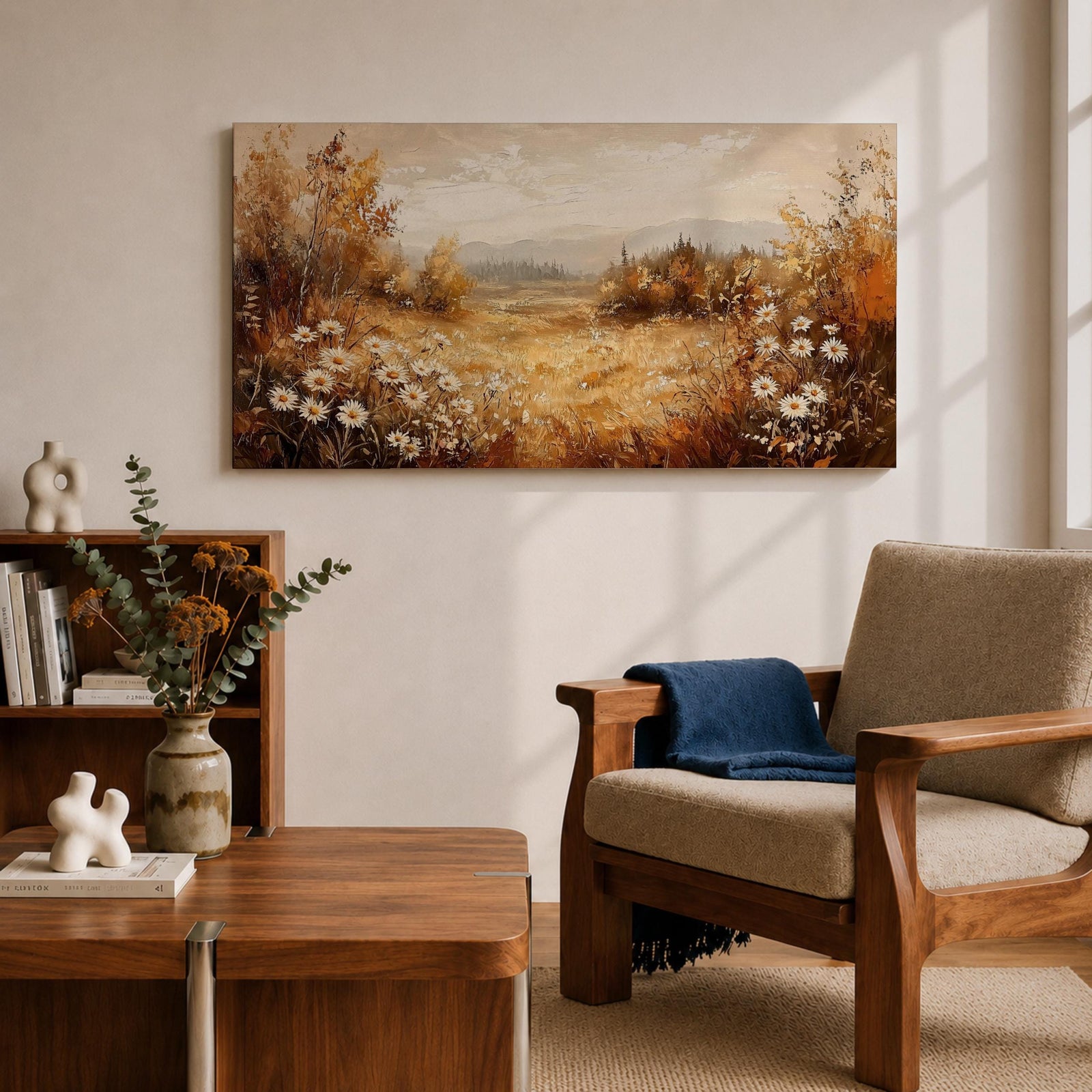 Panoramic landscape painting depicting a golden autumn meadow with white daisies blooming along the foreground. Warm earthy tones fill the grassy field while trees with autumn foliage frame the scene and distant hills fade softly beneath a calm sky.