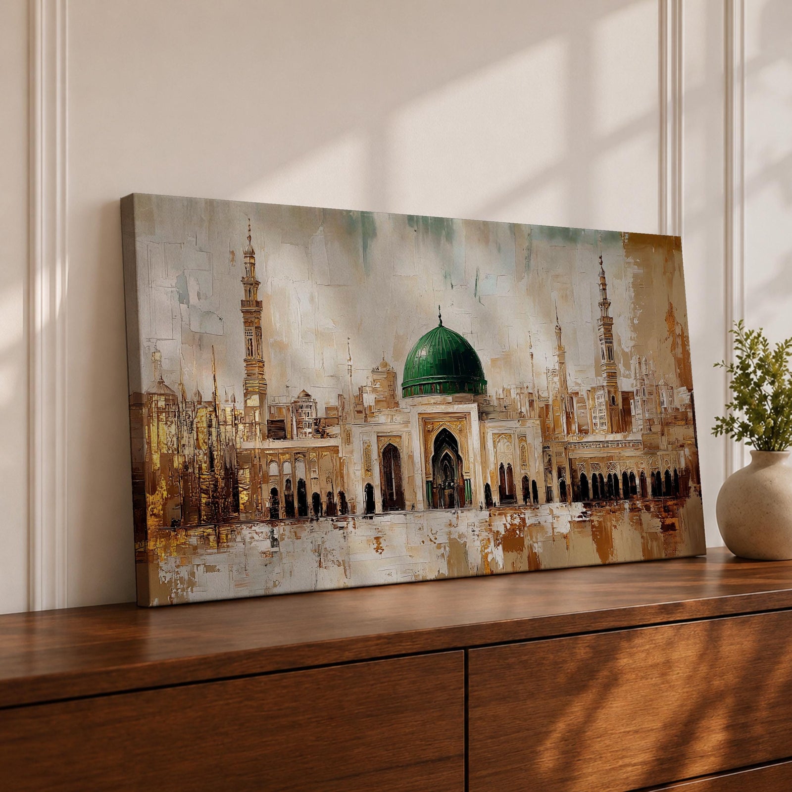 A panoramic painting of Masjid Al Nabawi in Medina featuring the iconic green dome centered among elegant mosque arches and tall minarets, rendered with textured brushstrokes and warm beige and gold tones that highlight the sacred architecture and expansive courtyard of the historic Islamic landmark.