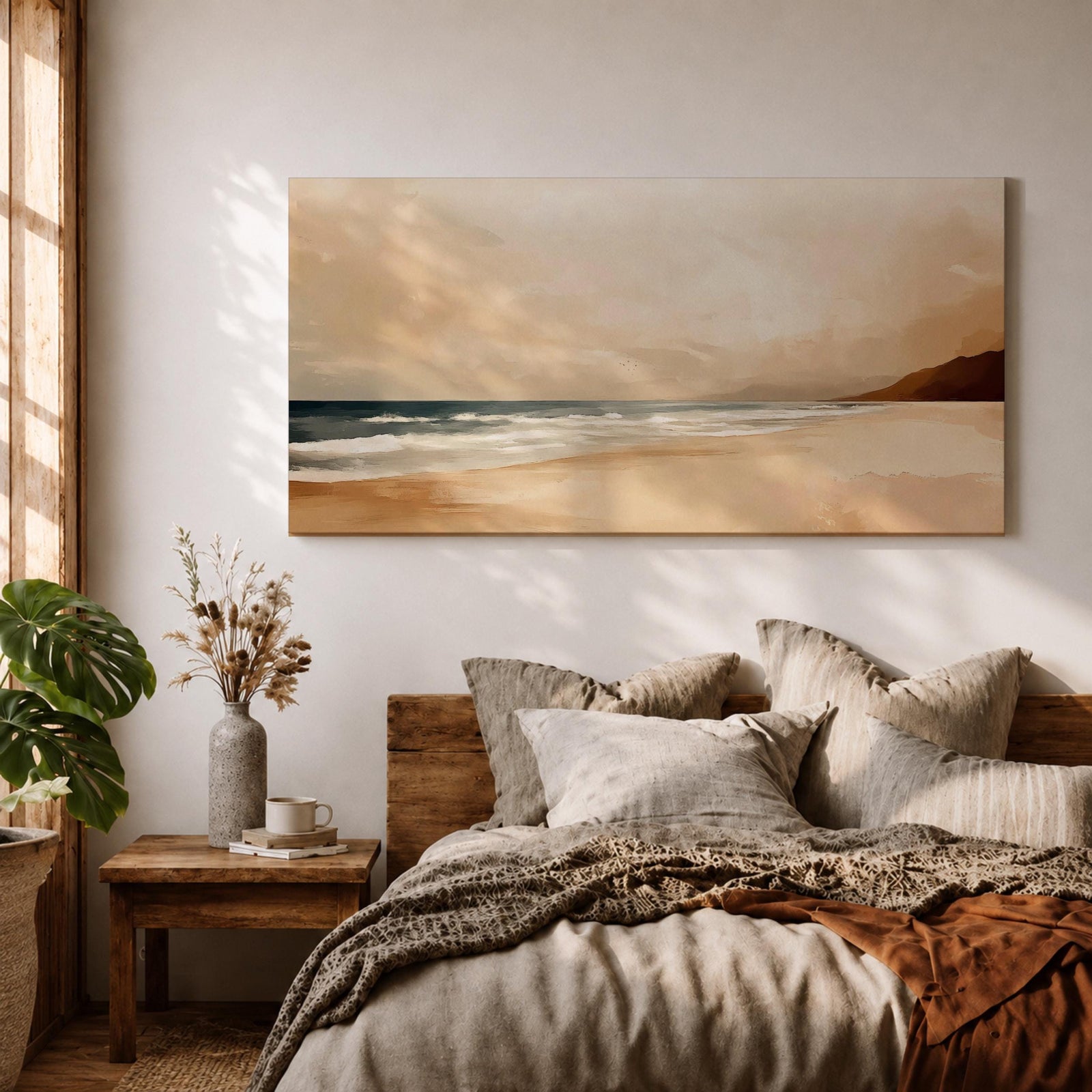 Panoramic coastal landscape painting showing a quiet sandy beach with gentle ocean waves rolling onto the shore beneath a soft sky. Subtle tones of beige, blue, and warm gray create a calm atmosphere while distant hills stretch along the horizon and light reflects across the water.