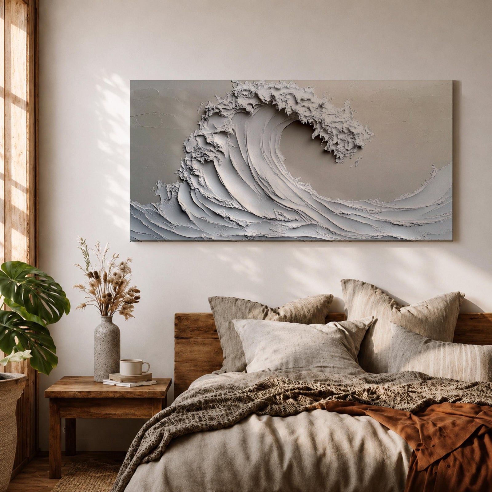 Panoramic textured relief artwork depicting a powerful ocean wave curling upward in sculpted layered forms. The cresting breaker is rendered with thick plaster like ridges and flowing contours in soft neutral tones, creating a minimalist seascape with depth and movement across the wide horizontal composition.