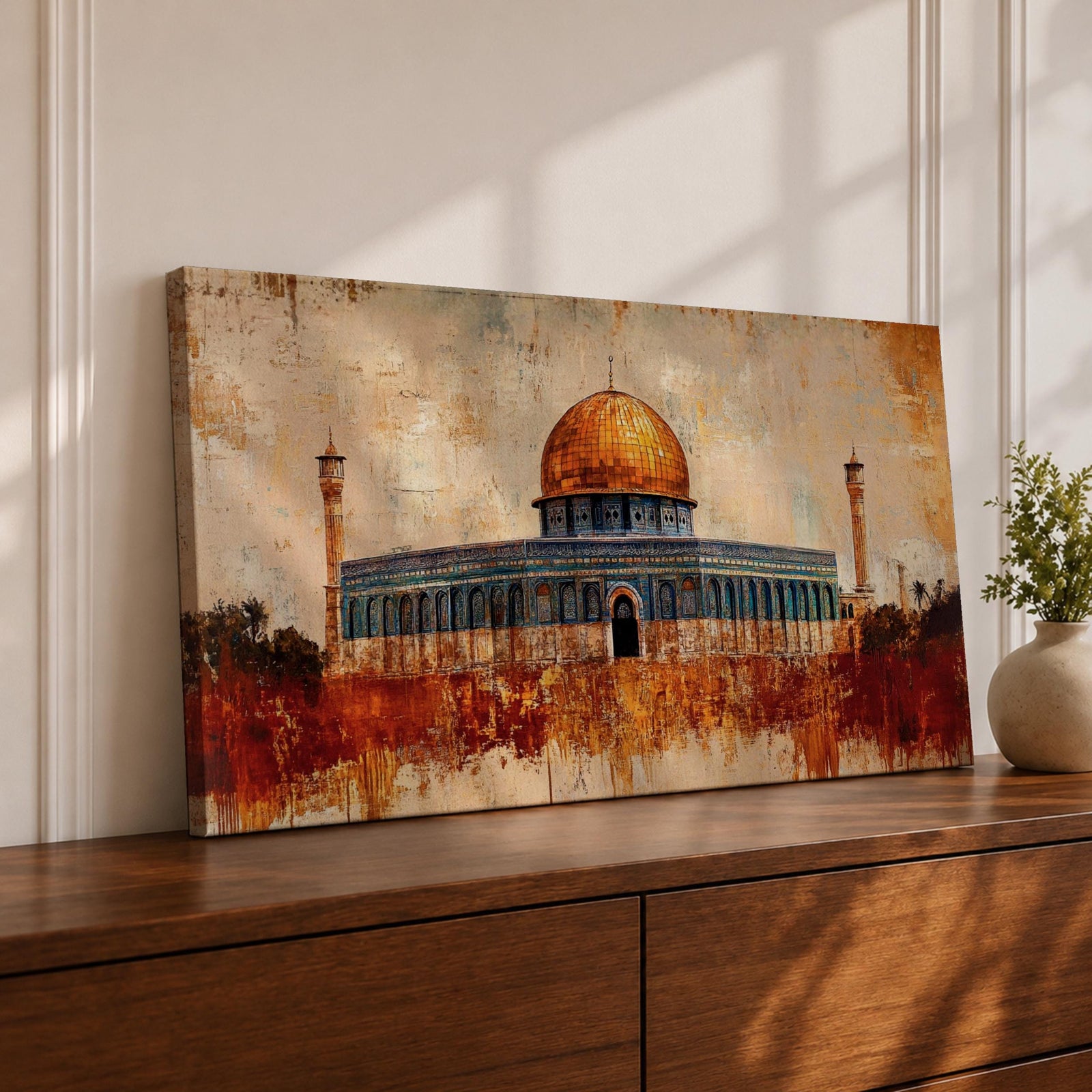 Panoramic abstract painting of the Dome of the Rock rising above the Jerusalem skyline with its golden dome glowing among historic stone buildings and mosque structures. Textured brushstrokes create layered architecture arches and rooftops while warm gold beige and blue tones spread across the wide Middle Eastern cityscape.